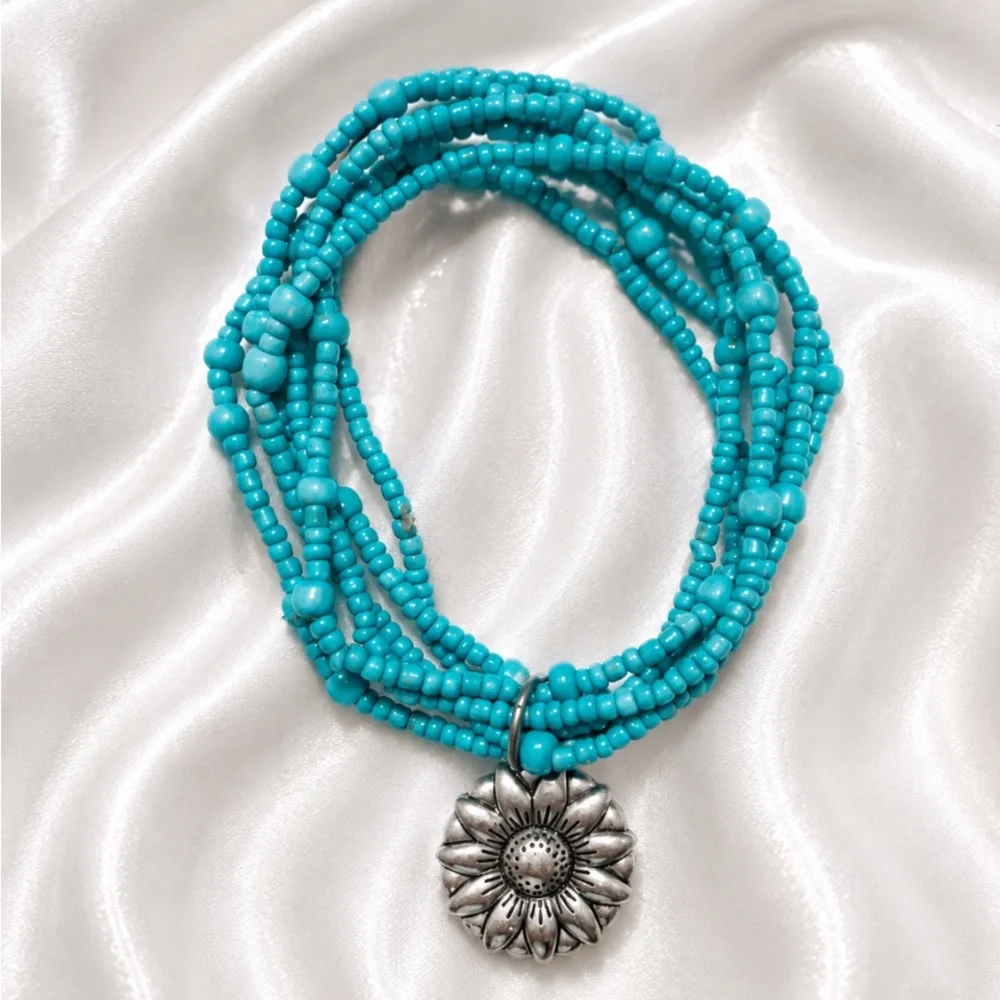 Turquoise Seed Bead Stretch Bracelet with Sunflower Charm